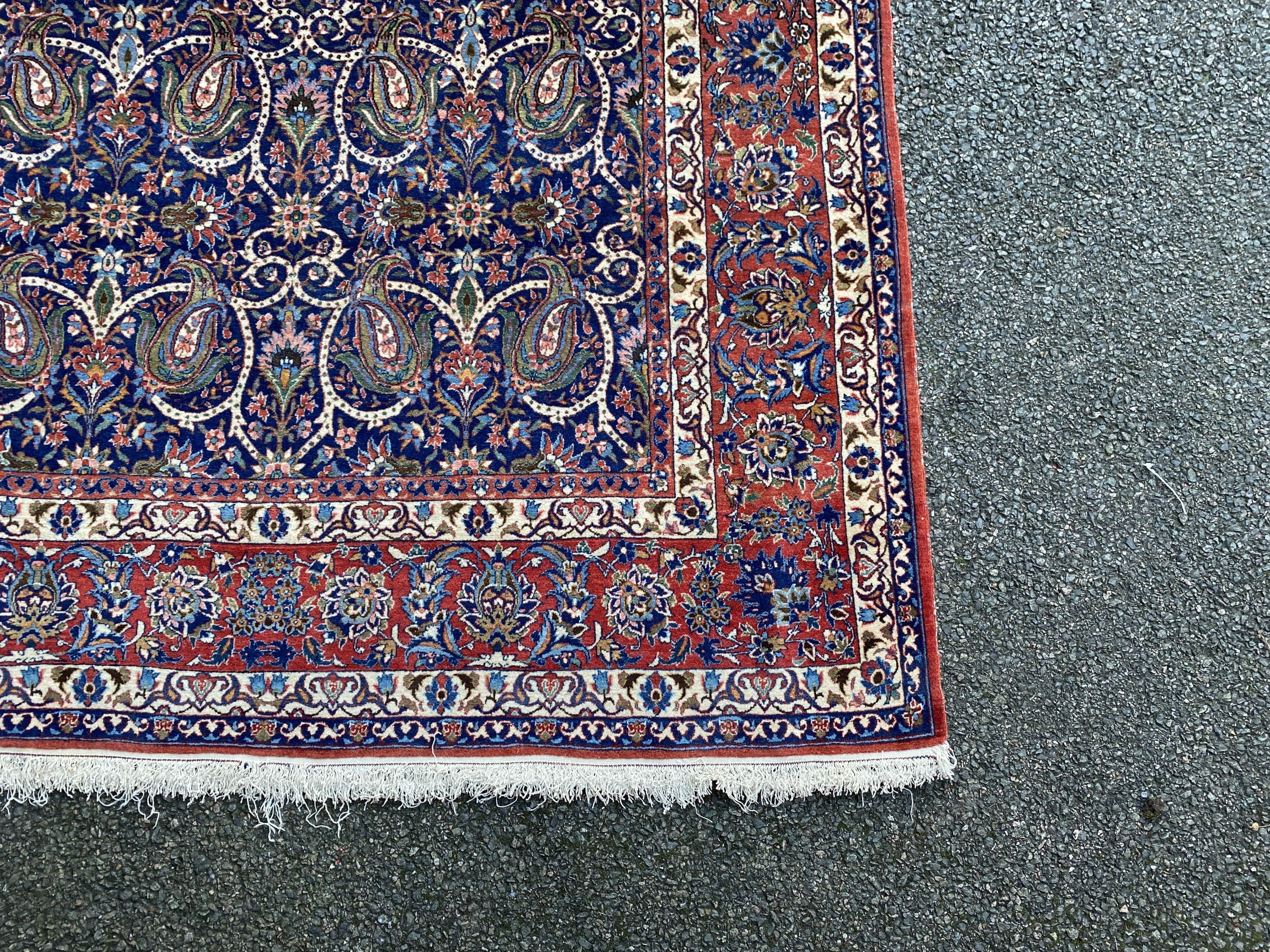 A Tabriz blue ground rug, first half 20th century, 225 cm x 155 cm